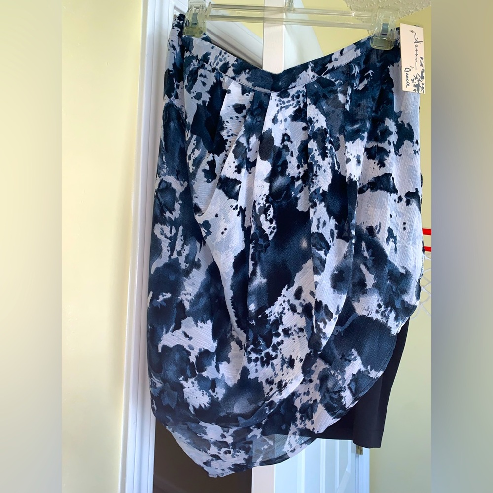Brand new sarong style skirt w/ tags . Never worn. Designer: Hanna & Gracie.